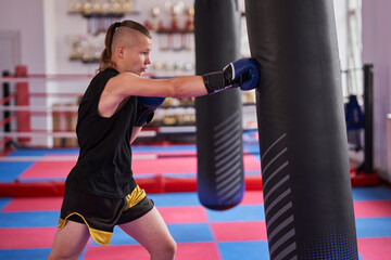 Kickboxer hitting the heavy bag