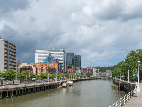View towards the Calatrava (Zubizuri) Bridge, River Nervion, Bilbao, Basque Country, Spain, Europe