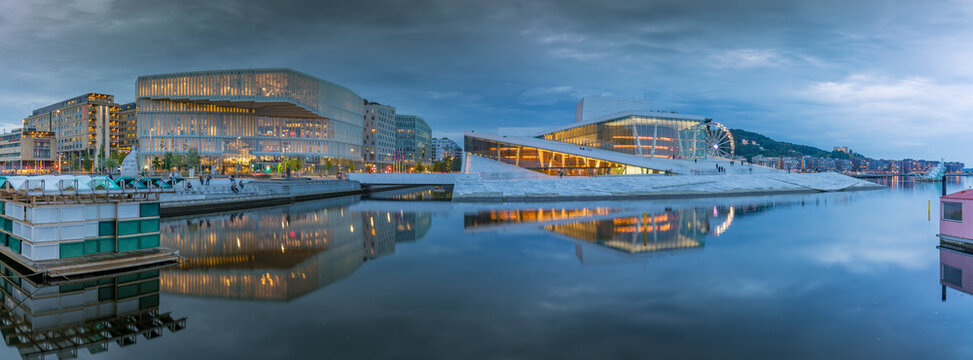 View of Public Library and Oslo Opera House reflecting in harbour on cloudy evening, Oslo, Norway, Scandinavia, Europe