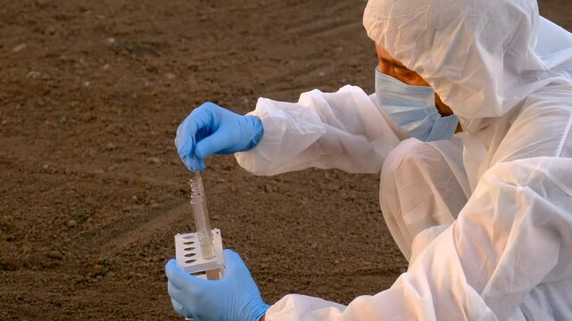 Taking soil samples in nature. Selective focus.