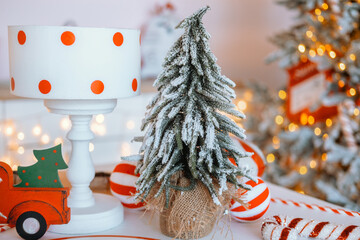 Cozy festive decoration with a mini Christmas tree and snow-dusted accents