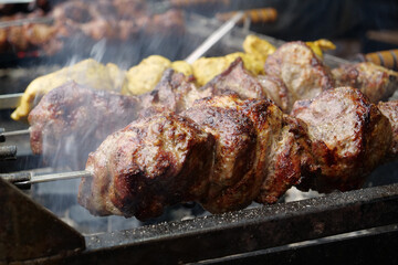 Shish kebabs broils in barbecue. Delicious hot kebabs. Meat are cooked