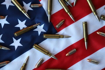 Bullets with USA flag in dark light. Patriotic background image with ammo and United States flag