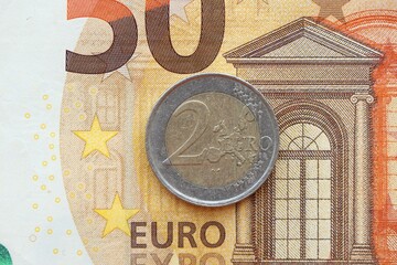 European currency euro cent coin lies on euro banknote bill