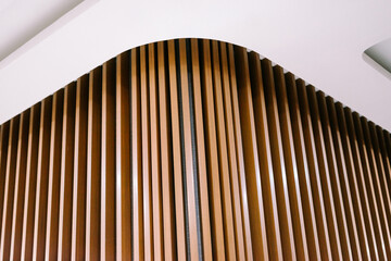 An elegant wall design featuring wooden panels, creating a sophisticated and warm ambiancee