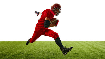 Naklejka premium Dynamic image of American football player in red uniform sprinting across the field while holding the ball, training, competing for victory. Concept of sport, competition, tournament, game. Copy space