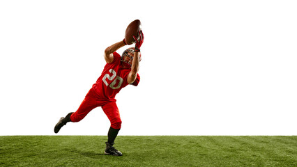 Full-length dynamic image of man, American football player in red uniform in motion on field, running and catching ball, training. Concept of sport, competition, tournament, game. Copy space
