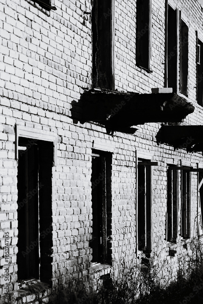 Poster a monochrome image of a brick structure.
