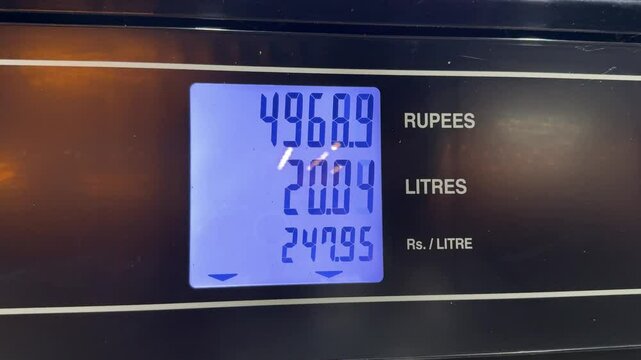 Petrol price in a fuel station in pakistan. Petrol pump meter with prices and liters. Gas station meter while car refueling. 