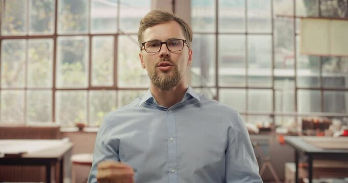Stylish Creative Man Does Video Call from Home Office. Professional Talking to Business Partners, Associaets, Clients, Colleags via Online Conference Chat. POV from Camera 