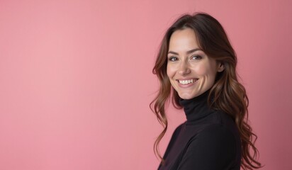 Fototapeta premium Woman with radiant smile wearing black turtleneck against pink background with copy space