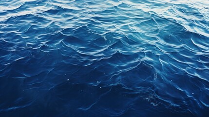 Obraz premium the dark blue sea surface, highlighting the gentle undulations that create a mesmerizing pattern.