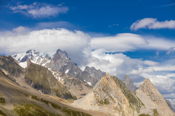 Naklejka premium Chamonix rocky granite mountain peaks in french Alps around Mont Blanc summit in Chamonix valley. Scenic landscape of iconic alpine summits the legends of mountaineering and alpinism