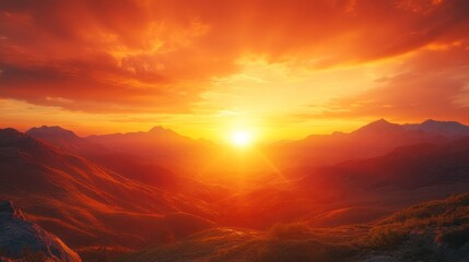 A stunning sunset over a rugged mountain range. The sky is orange and red.