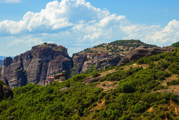 Holy Monastery of the Great Meteoron, Varlaam monastery and Holy Monastery of Rousanos as seen from the observation deck of Meteora, Greece. View in order: upper right corner, from top to bottom
