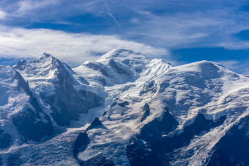 Chamonix rocky granite mountain peaks in french Alps around Mont Blanc summit in Chamonix valley. Scenic landscape of iconic alpine summits the legends of mountaineering and alpinism