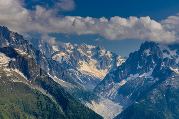 Obraz premium Chamonix rocky granite mountain peaks in french Alps around Mont Blanc summit in Chamonix valley. Scenic landscape of iconic alpine summits the legends of mountaineering and alpinism