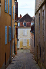 Typical French village facade and street in Burgundy, France, during autumn