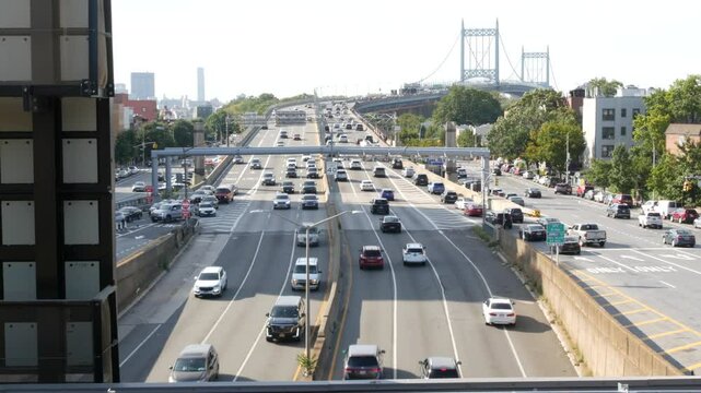 Triborough Bridge in Astoria, Robert F. Kennedy Bridge, New York City. Car traffic on road, multiple lane transport highway from elevated subway station in Queens near Ditmars Steinway, NYC, USA.