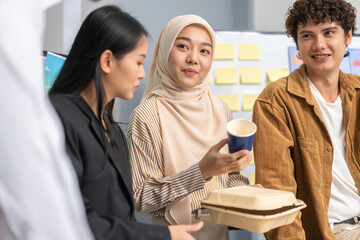 Obraz premium Diverse team professionals collaborating on sustainable development project during a corporate meeting, presentation eco-friendly designs with charts and data on renewable energy and green technology