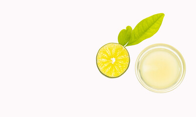 Fresh and detoxifying lemon juice in the bowl - Citrus latifolia.