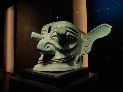 Chengdu, China - October 26, 2024: Masks and sculptures in the mysterious Sanxingdui culture. People are visiting. An archaeological site known for the discovery of aliens and an important Bronze Age 