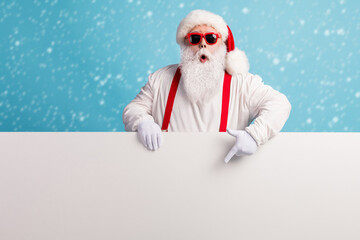 Portrait of his he nice attractive funky amazed wondered white-haired Santa demonstrating copy...