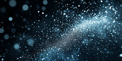 Obraz premium Snow falling over a dark background resembling festive silver glitter 