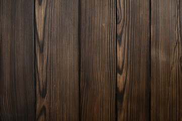 Textured wooden background close-up with vertical lines in dark brown tones. A natural surface with pronounced wood fibers and knots that add depth and a natural look.