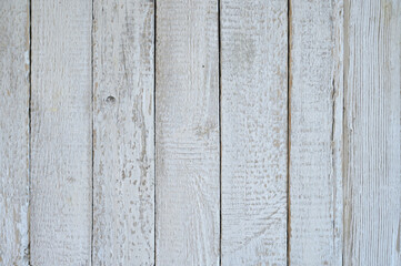 Naklejka premium White background from vertical wooden boards. Each board has a natural texture with slight bumps, small knots and visible wood grain.