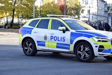 Police car on a city road. © Natalia
