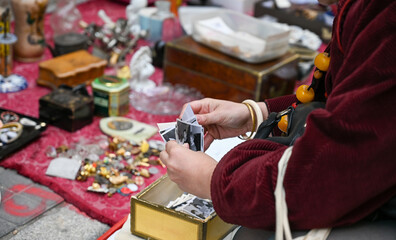 A person looking for some deals in a flea market