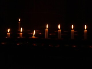 Serene candlelight in darkness