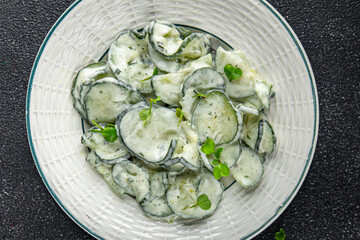 Сucumber salad fresh cream tasty food dish fresh delicious gourmet food background on the table rustic food top view copy space top view keto and paleo diet Vegetarian and vegan food