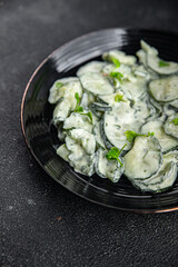 Сucumber salad fresh cream tasty food dish fresh delicious gourmet food background on the table rustic food top view copy space top view keto and paleo diet Vegetarian and vegan food
