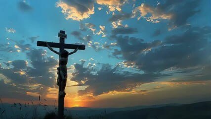 Silhouetted crucifix against a vibrant sunset with dramatic clouds.