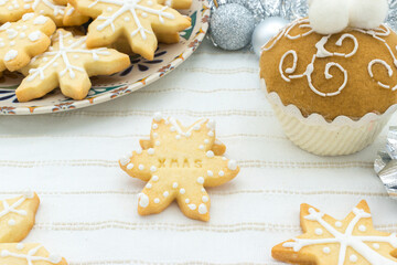Fototapeta premium Snowflake-shaped sugar icing Christmas cookie with the message 