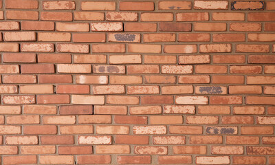 Obraz premium A classic vintage room with red and brown brick walls slightly weathered with rough textures