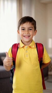 A smiling young boy wearing a yellow polo and backpack, giving a thumbs up gesture, symbolizing confidence and school themes.