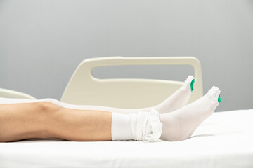 After surgery, pregnancy or varicose veins the patient is dressed in compression stockings by the...