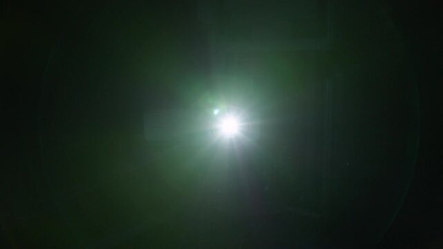 The video projector lights up and dazzles us with cold-coloured flashes of light