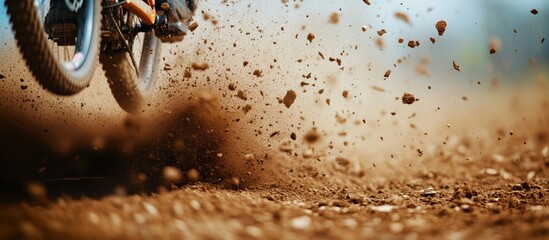 Fototapeta premium Mountain bike kicking up dirt and dust, dynamic action shot, outdoor adventure