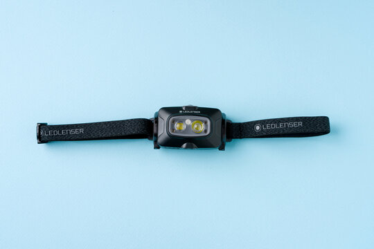 Antalya, Turkey - October 16, 2024: Ledlenser HF4R Core headlamp on blue background. Led Lenser headlamp