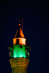 Obraz premium The vertical night photo of Mohammad Al Amin Mosque minaret with the lonely stars in the sky, at Beirut, Lebanon. 
