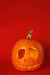 Empty Pumpkin head on red background. Halloween holiday concept.