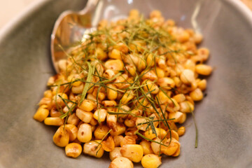 close up Chinese Cantonese pan fried sweet corn with soy sauce