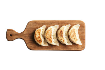 Asian gyoza dumplings served on a wooden board