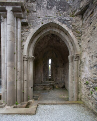 Fototapeta premium Corcomroe Abbey. Early 13th century. (Mainistir Chorca Mrua) was a Cistercian foundation situated in a green valley surrounded by the grey limestone landscape of the Burren. 