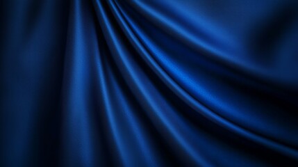 Elegant and luxurious deep blue satin fabric flowing smoothly ideal for fashion and interior design projects