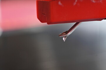 close-up of record player stylus with soft focused background